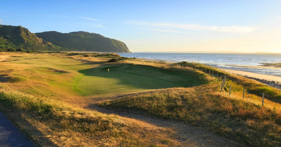 A view of Conwy Golf Club course with the sea in the background