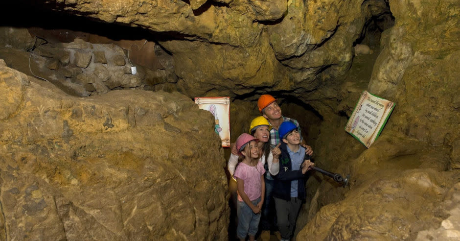 Visitors in the Great Orme Mines looking up