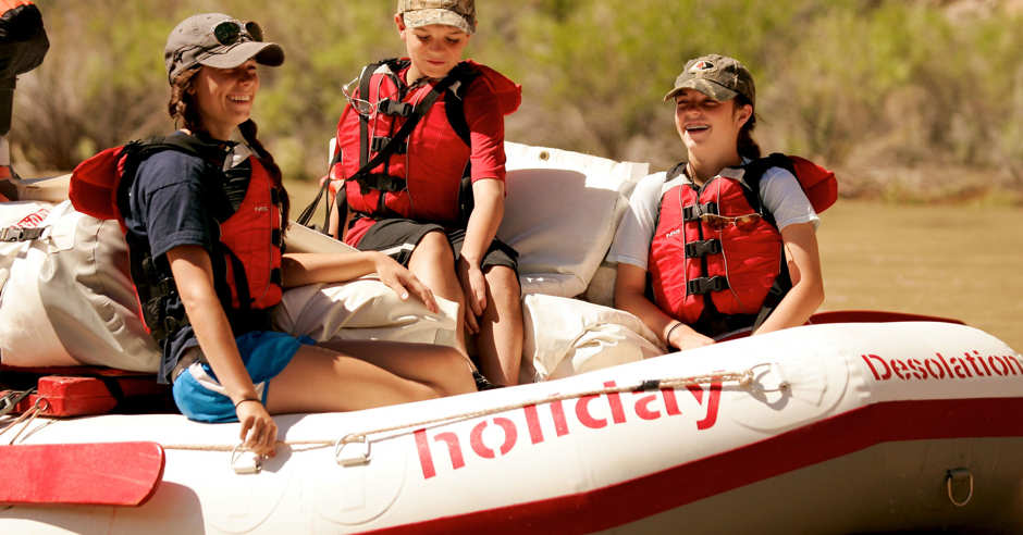 Women and children on a raft on Desolation Canyon with Holiday River Expeditions