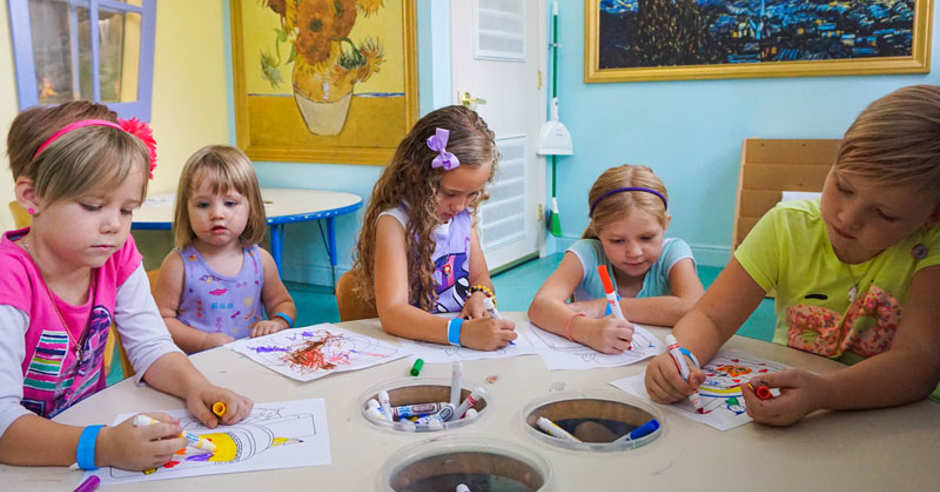 Kids sitting around a table coloring at a Kids Museum