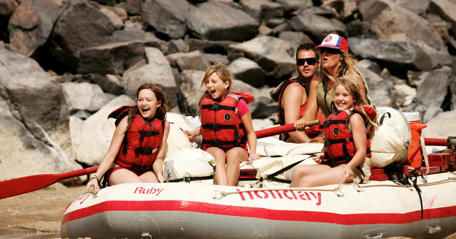 Family rafting down Westwater Canyon with Holiday River Expeditions