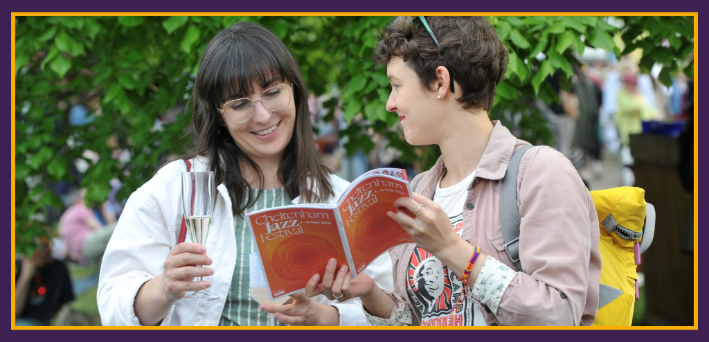 Ladies reading the Cheltenham Jazz Festival brochure