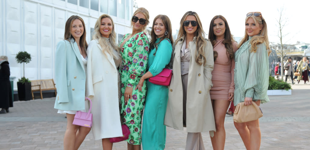 A group of ladies dressed fashionably at the Cheltenham Festival at Cheltenham Racecourse.