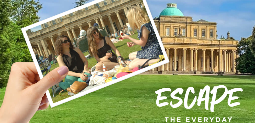 Escape the Everyday image of Pittville Pump Room and visitors sat on the lawn.