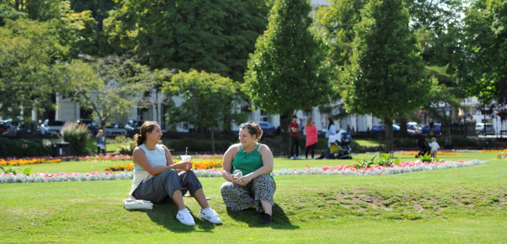 Ladies sat in Imperial Gardens in Cheltenham