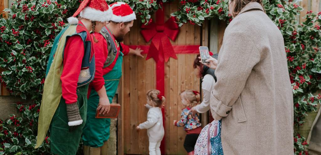 Santa's helpers with children at Cotswold Farm Park