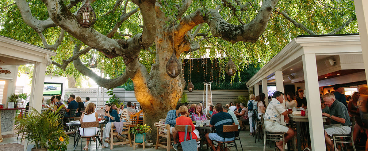 The exterior dining tables at Anejo
