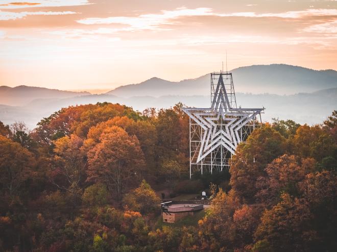 The Roanoke Star among fall foliage in the Blue Ridge Mountains