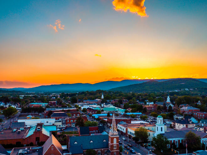 Aerial view of Salem, VA as the sun sets over the mountains