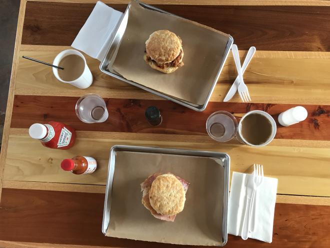 Aerial shot of two biscuits and coffees on a table at Scratch Biscuit Co.