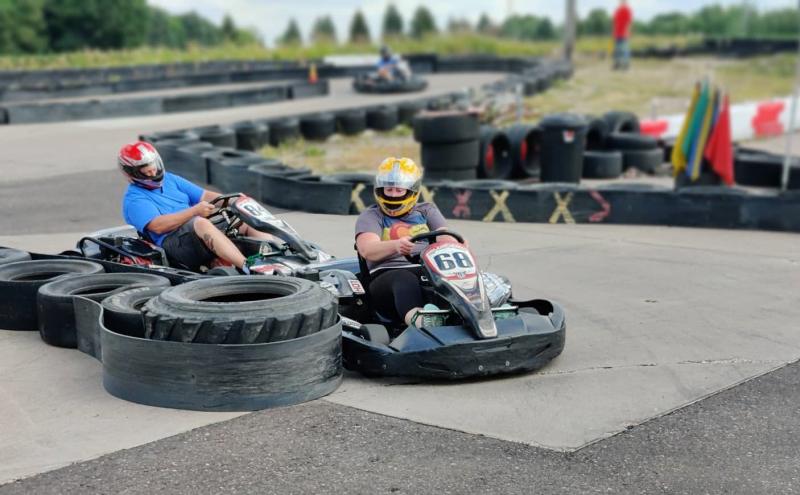 Two race car drivers taking a turn