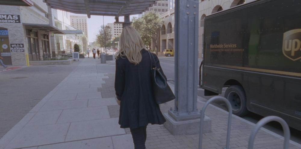 Song to Song screengrab, showing Amanda walking through Downtown Austin