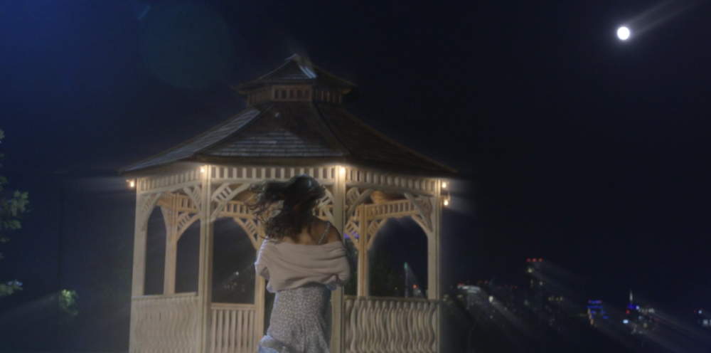 Walker screengrab showing Walker dreaming of his deceased wife as she runs to a gazebo at night, is in Zilker Park