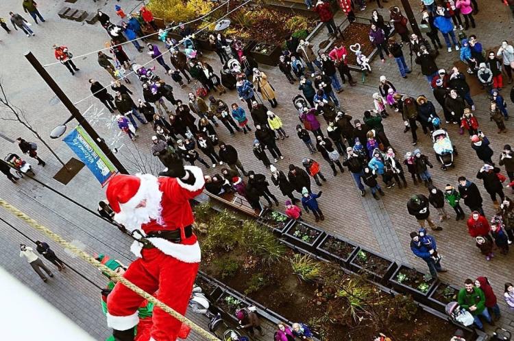 santa propelling down a building on the commons 