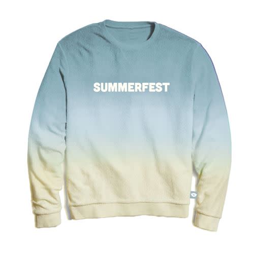 A cozy crewneck sweatshirt featuring a soft dip-dye gradient from light blue at the top to sandy beige at the bottom. The word "SUMMERFEST" is printed in bold white capital letters across the chest.