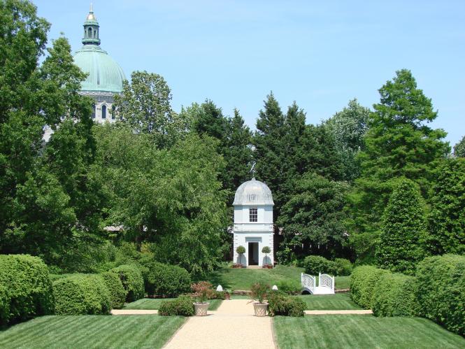 A view of the William Paca House Garden with the Naval Academy Chapel Dome in the Background