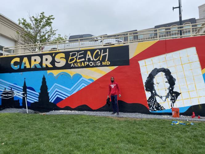 Comacell in front of the Carr's Beach mural at MC3
