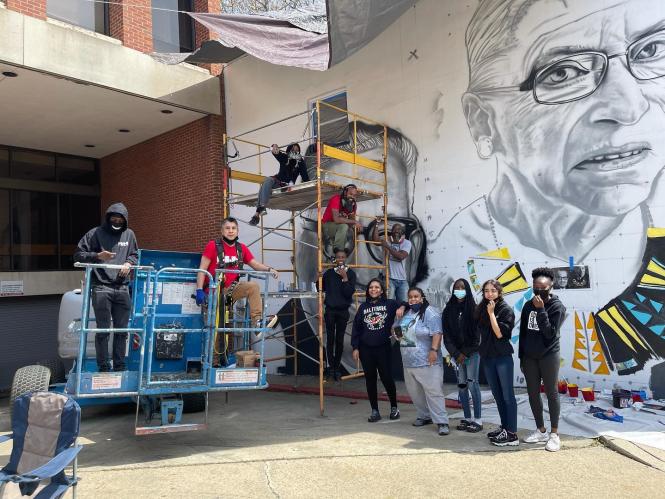 A mural in progress with the Kids making History Mural team.