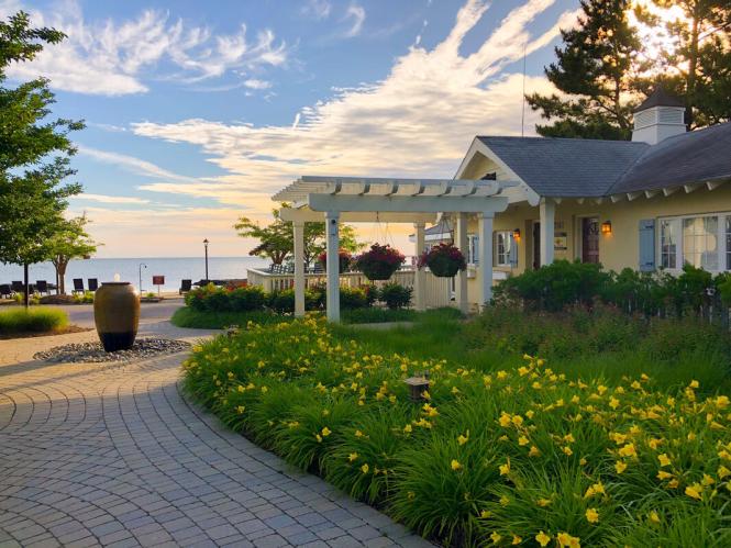 The exterior of the Inn at Herrington Harbor with water view.