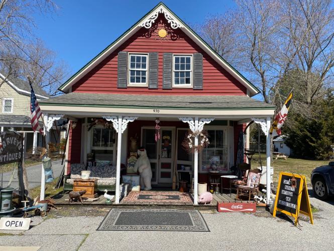 Captain Harvey's has numerous antiques across the porch of their vintage building.