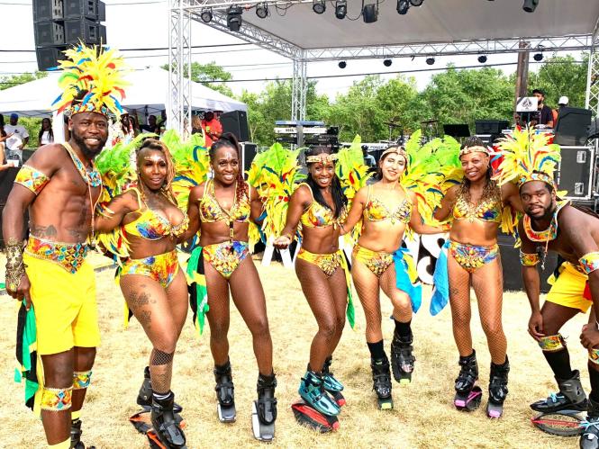 Karnival Bounce Dancers line up in costume and smile for a photo