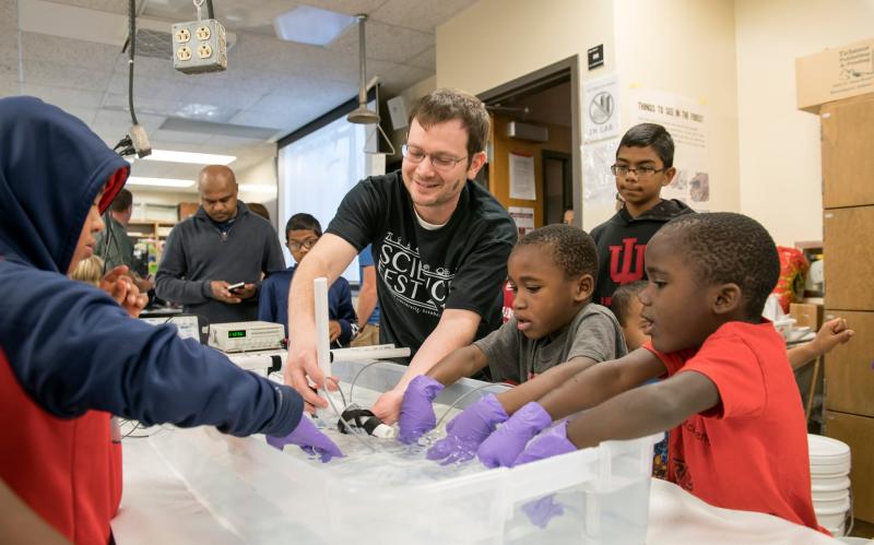 Kids participating in a hands-on activity at Science Fest