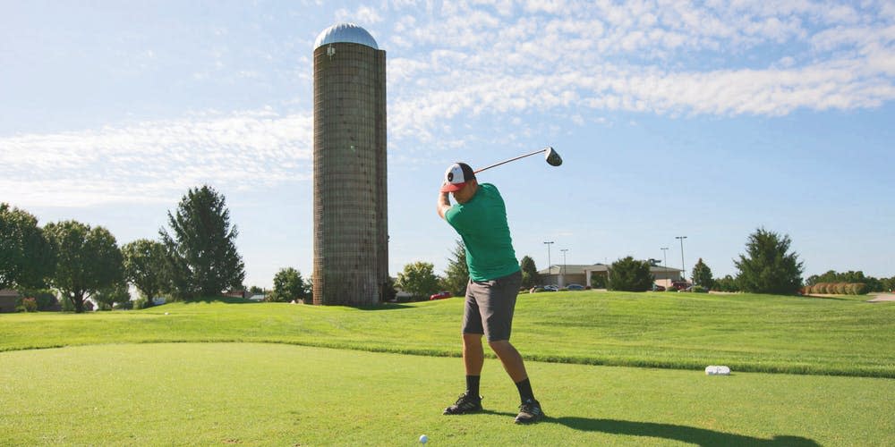 Teeing off in front of the silo at Silo Ridge Community Golf Course.