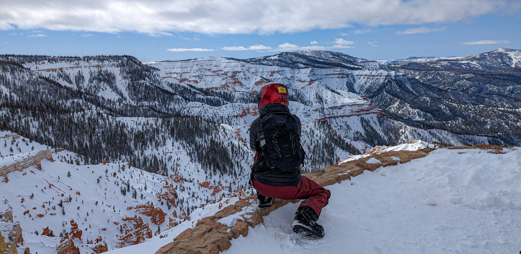 Looking out at the red rock formations of Cedar Breaks National Monument  dusted in snow from the Northern Overlook.