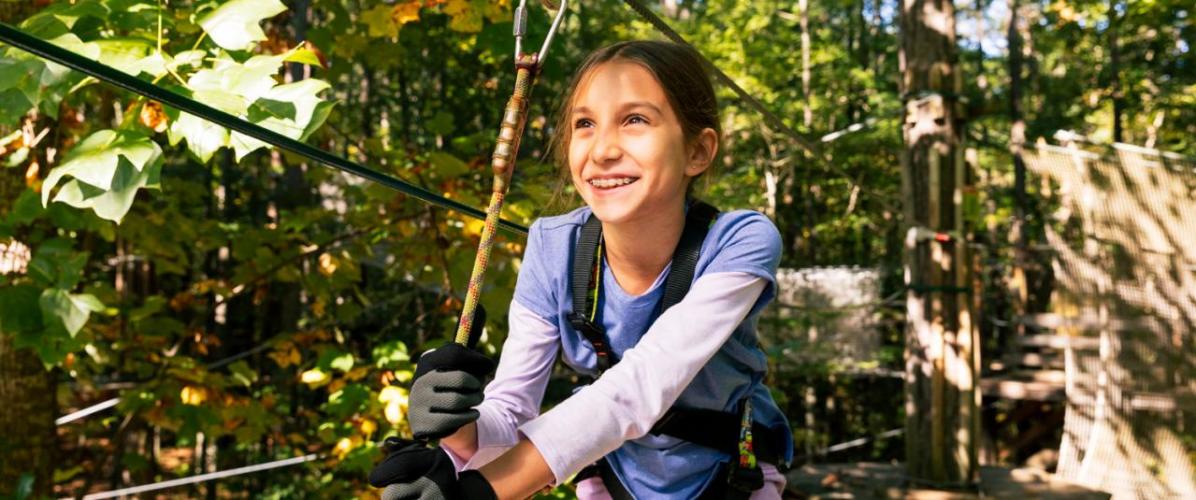 Girl on zipline at Go Ape