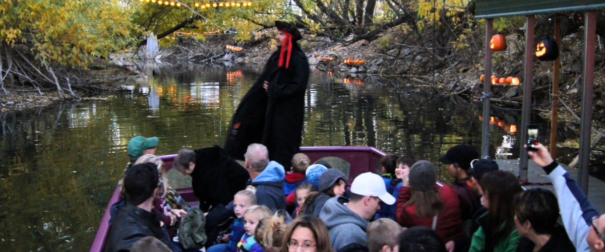 Man giving riverboat tour in halloween costume