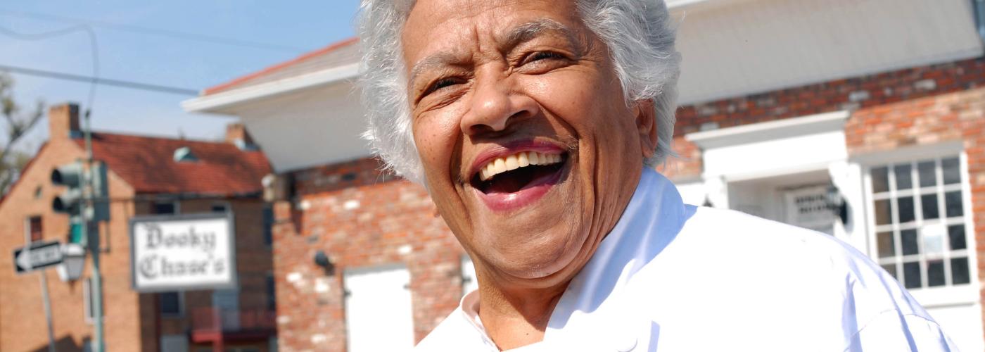 Leah Chase in front of Dooky Chase’s Restaurant