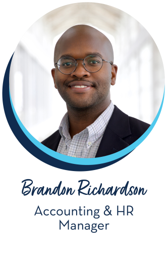Brandon Richardson Accounting & HR Manager, business man with round glasses wearing a white button down shirt and blue sport coat
