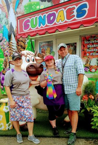 Saratoga Co. Fair family posing by sundae stand