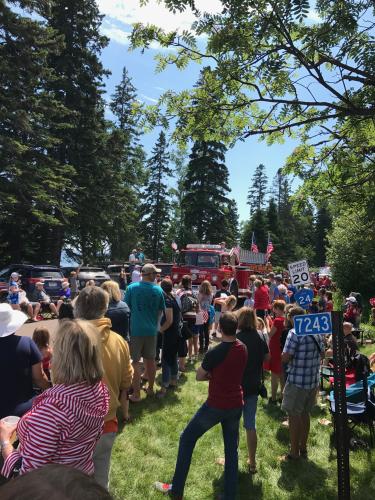 A crowd of people at the Tofte 4th of July Parade