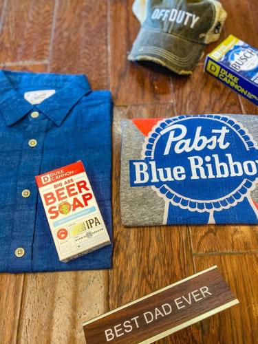 Display of Father's Day gifts on wooden table