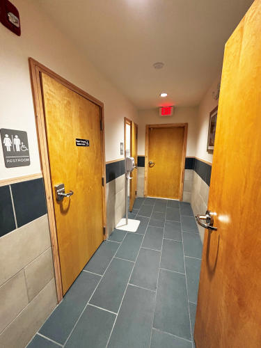 Two single-occupancy public restrooms at the Visit The Northshore Visitor Center include accessible features and a diaper changing station.