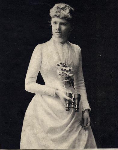 Old photo of Reubena Walworth dressed in white and holding flowers