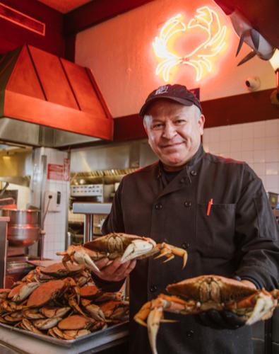 Chef Cecilio Rojas at Pier Market preparing Dungeness Crab