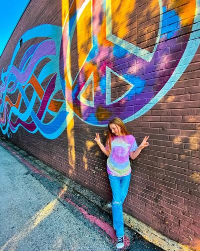 girl with mural at Mellow Mushroom