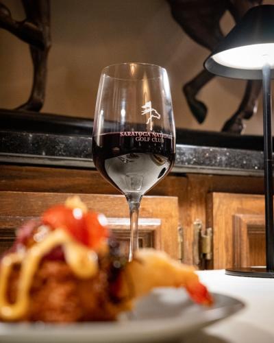 wine glass on table at saratoga national
