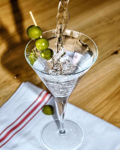 martini with three green olives