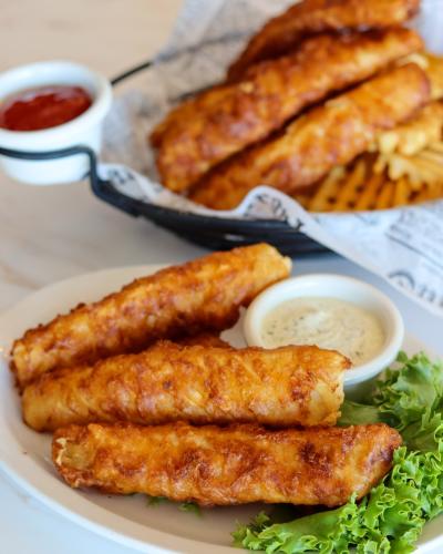 Fish Fry special at The Tavern Grill Woodbury showing a re-fill of fish at a discounted price.
