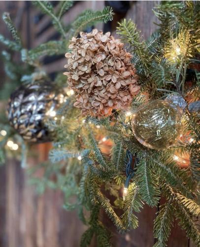 Holiday boughs, pine cones and lights