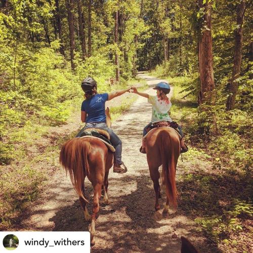 People riding horses at Deam Lake in Southern Indiana