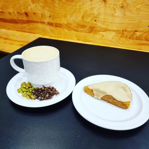 Community Grounds Cardamom Clove Latte with a pumpkin scone.