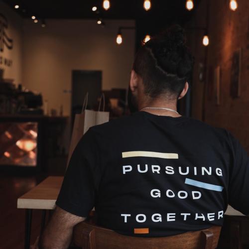 Shirt from Third Way Cafe that says "Pursuing Good Together"