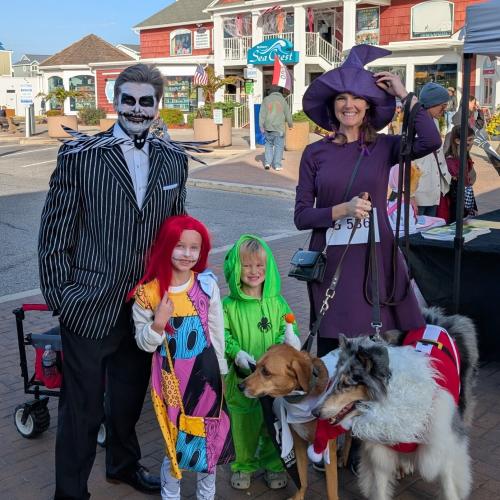 A family dressed as characters from A Nightmare Before Christmas poses for a photo in Bethany Beach, Delaware.