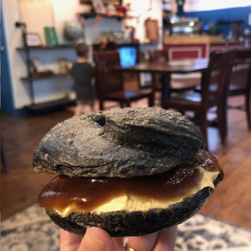 Canadian Bakin dark bagel filled with toppings