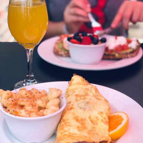 Breakfast at Famous Toastery in Huntersville includes an omelet and mimosa.