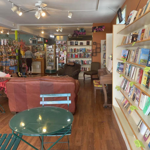 LaDeDa Books green table and bookshelves in Manitowoc